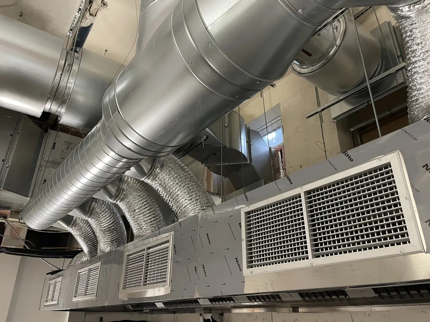 Purified Air filtration unit and extract ductwork being installed above a commercial kitchen at Dakwala Bombay Canteen