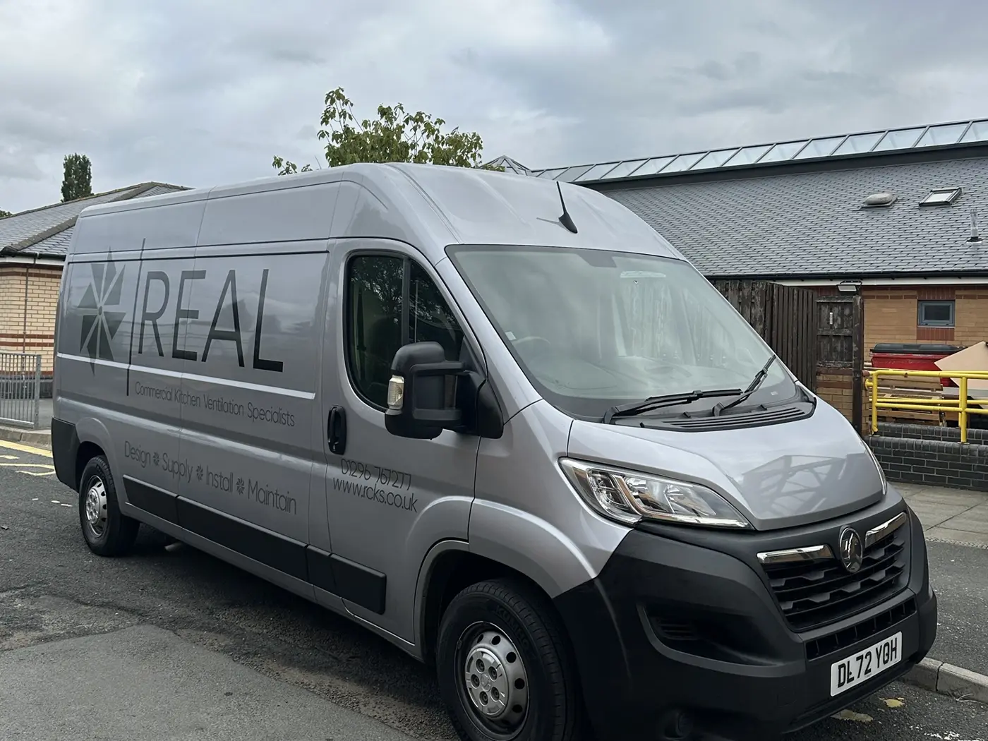 REAL Ventilation site team van outside a building on a job